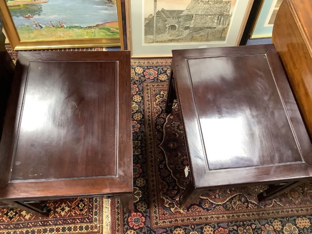 A 20th century Chinese rectangular hardwood low coffee table and a pair of similar lamp tables, largest width 106cm depth 51cm height 40cm